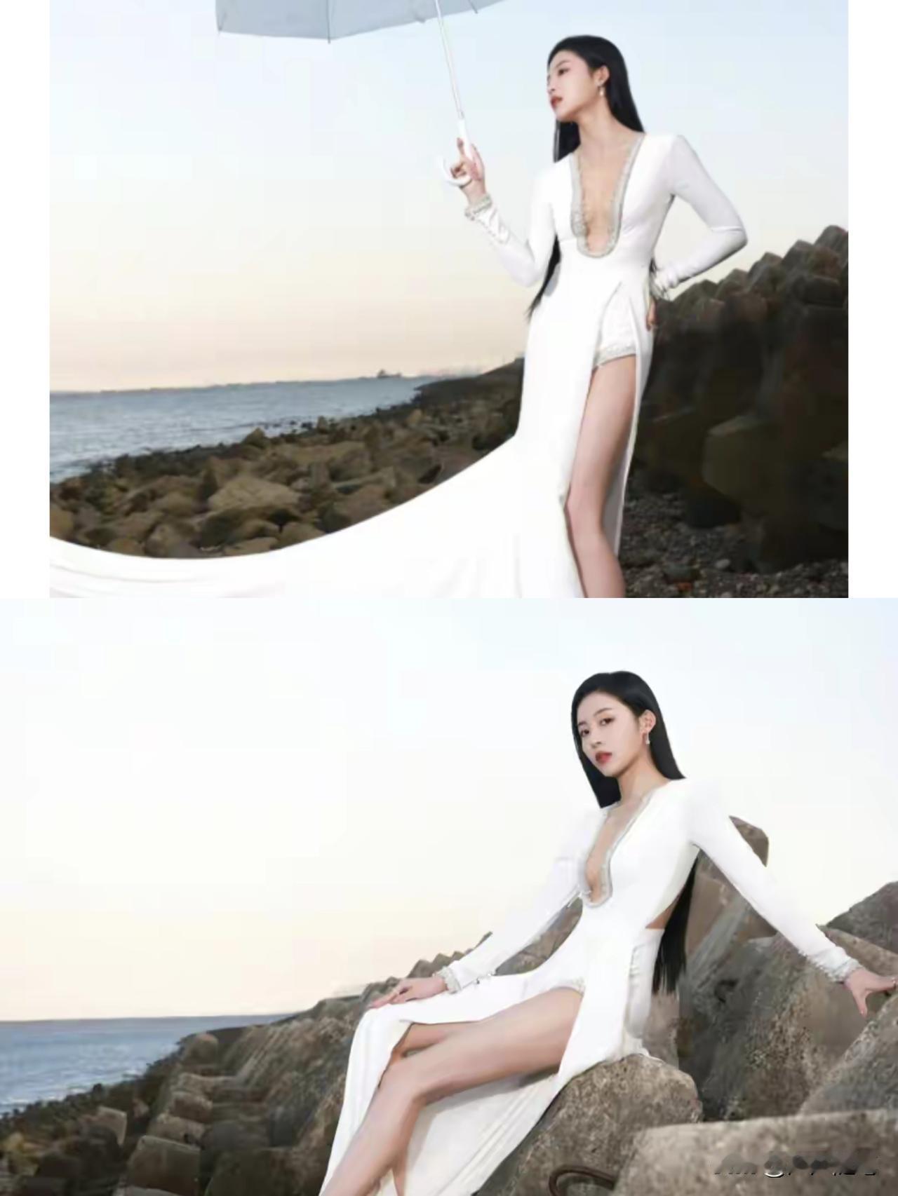 穿白裙子的美女在海边拍照。