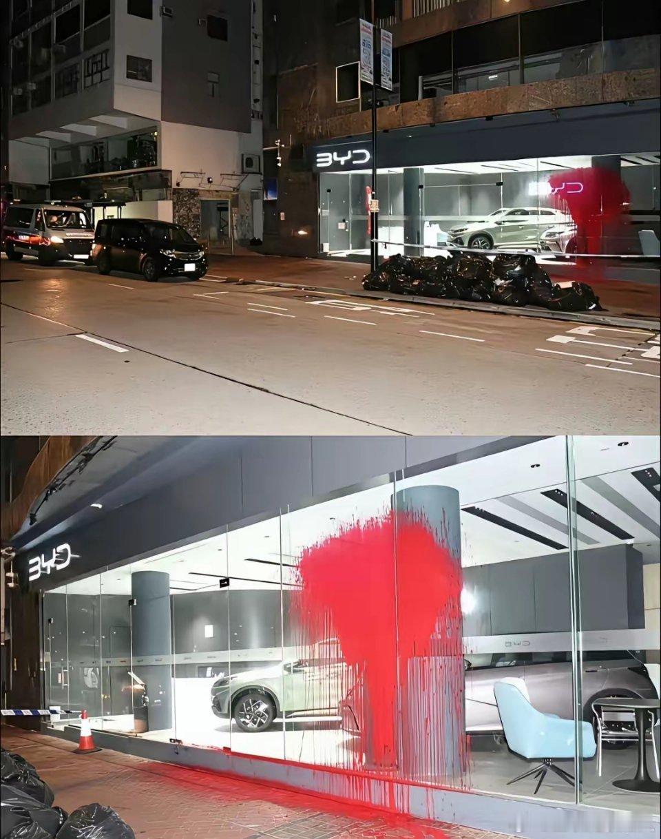 刚进入香港时的比亚迪，看那红油漆，还有被砸烂的卷闸门，就能知道当地商业垄断有多过