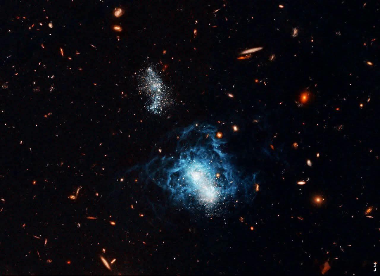 宇宙晚开之花：哈勃望远镜发现有史以来最年轻的星系之一。想象一个星系，它基本上睡过