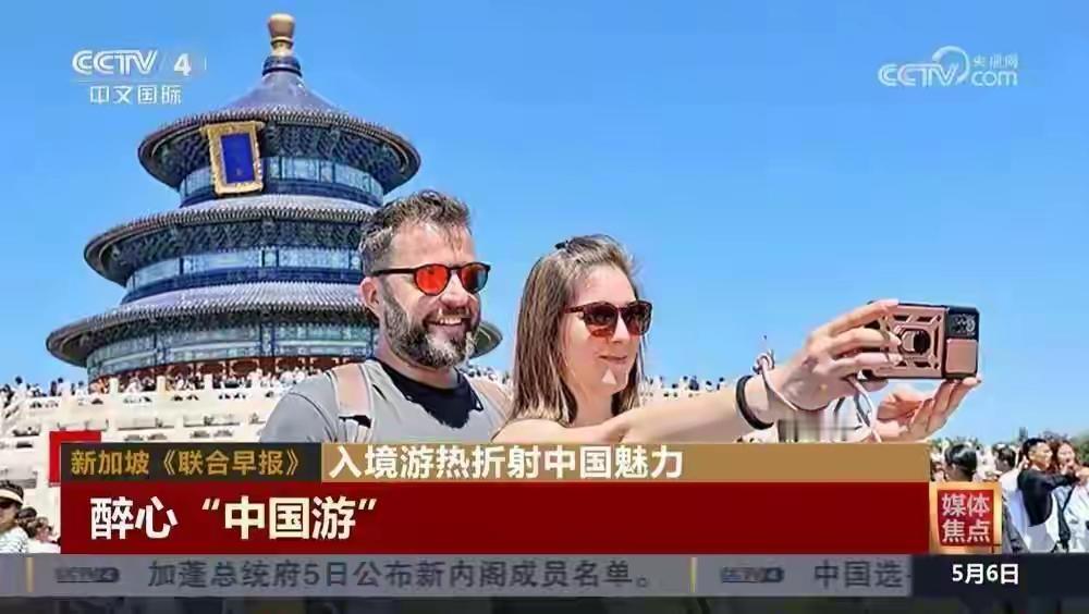 她说，明天你就要变成中国人了。没人当真。结果2026年五一，几十万老外真
