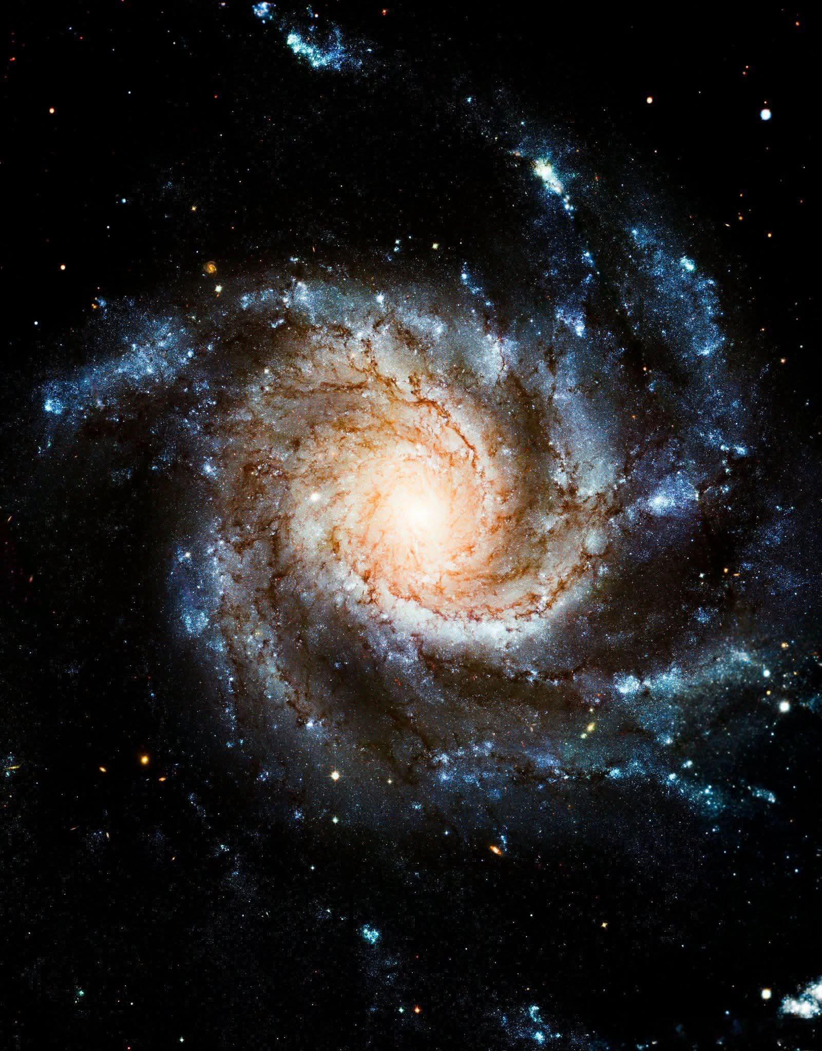 横跨近两倍于银河系宽度的广阔空间，包含一万亿颗恒星的卷积星系（梅西耶101）是一
